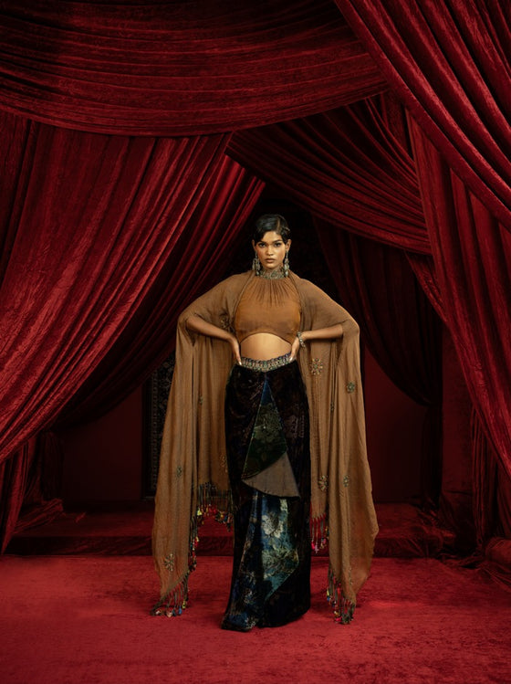 PRINTED VELVET DRAPE SKIRT WITH RUCHED HALTER BLOUSE & FLOWY DUPATTA CAPE