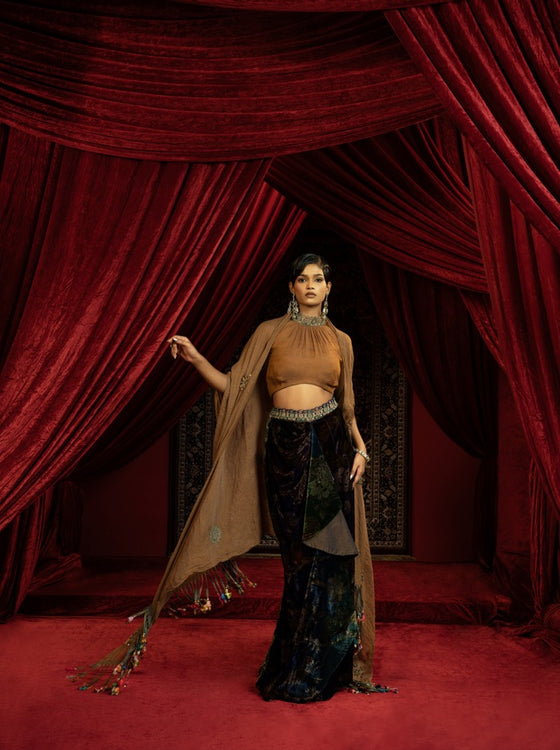 PRINTED VELVET DRAPE SKIRT WITH RUCHED HALTER BLOUSE & FLOWY DUPATTA CAPE