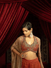 CRIMSON RED QUILTED BLOUSE WITH BOX PLEATED PANTS AND SEPIA BROWN CAPE