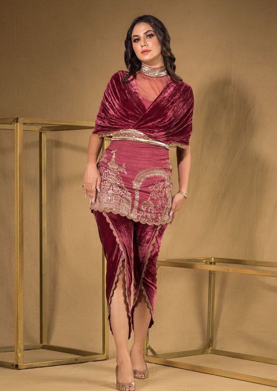 Short fitted kurta with velvet dhoti pants and drape with embroidered belt .